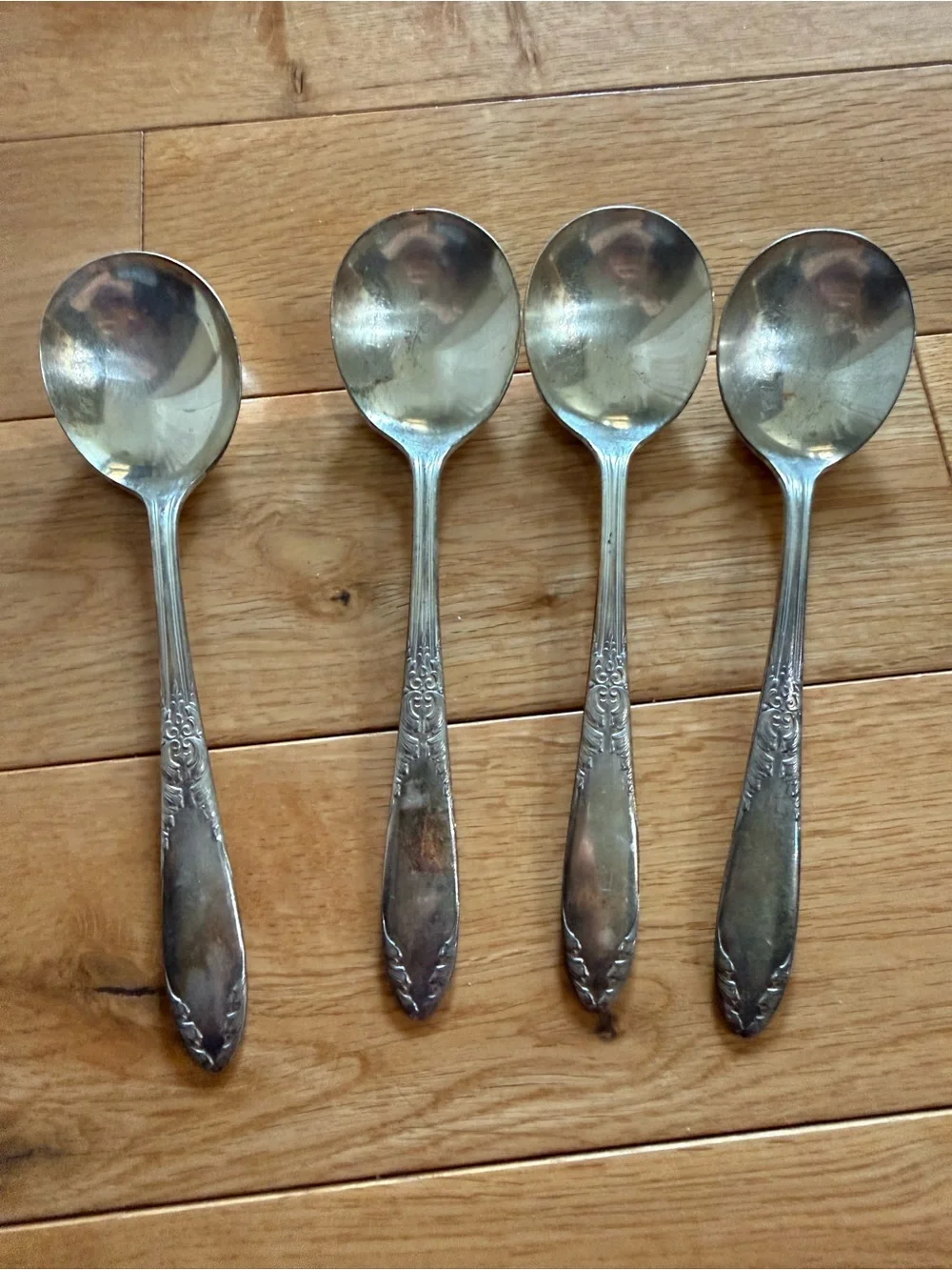 Set of 4 Silver-Tone Decorative Handle Soup Spoons